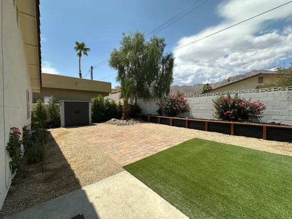 a view of swimming pool with a yard