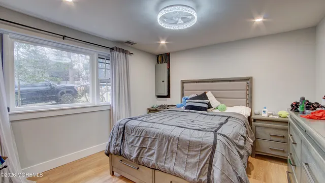 a bedroom with a bed and a view of bathroom