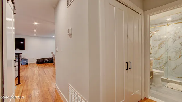 a bed room with a bed and a flat screen tv