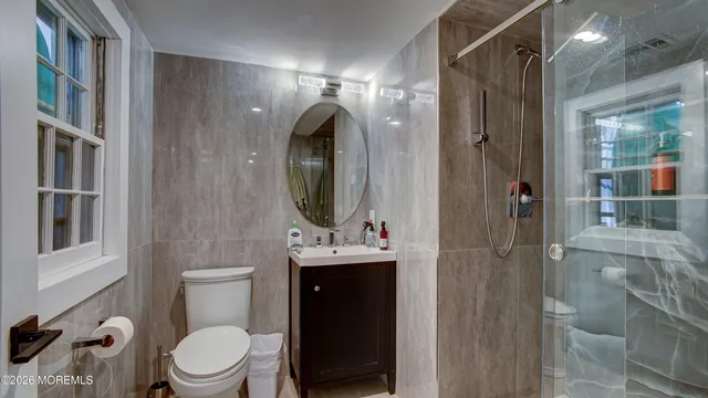 a view of a hallway with wooden furniture