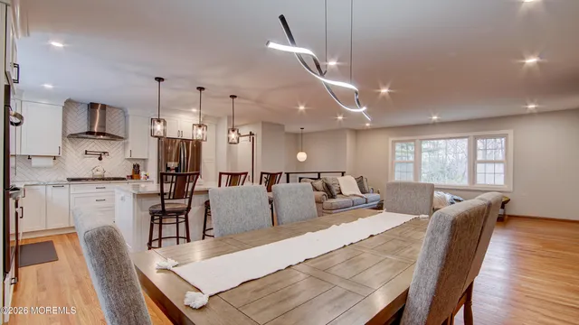 a large kitchen with a table and chairs