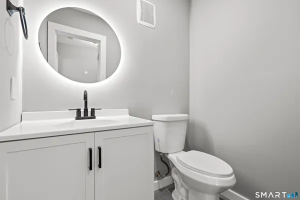 a bathroom with a toilet and a sink