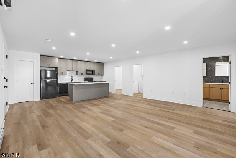 556 Main Street, Unit 2 Orange, NJ 07050 - Photo 3 of 9 a view of kitchen with wooden floor