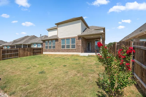 a front view of house with an outdoor space