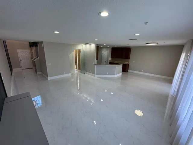 a view of a livingroom with a potted plant