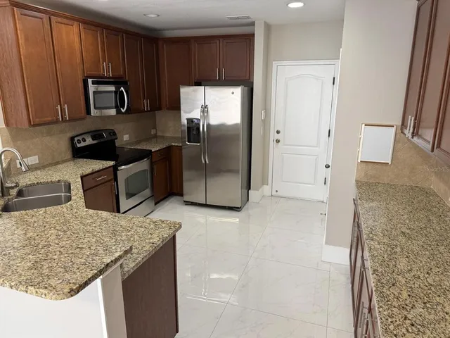 a view of living room with furniture and a flat screen tv