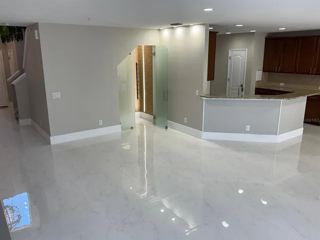 a view of living room with furniture and a flat screen tv