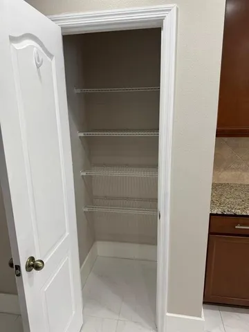 a bathroom with a sink vanity and shower