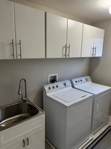 an empty room with closet and mirrors