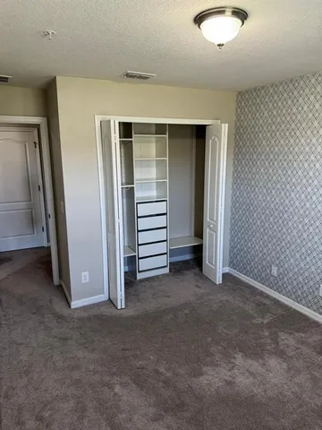 a bathroom with a tub a toilet and a shower