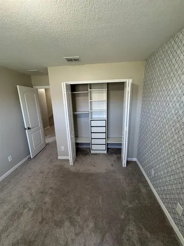 a white toilet sitting next to a shower