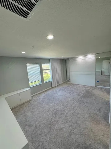 a bathroom with a shower and a sink