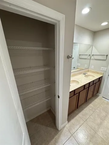 a view of a house with swimming pool and sitting area