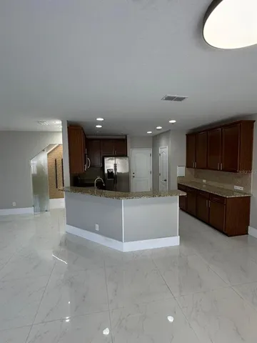 a toilet sitting in a bathroom next to a sink