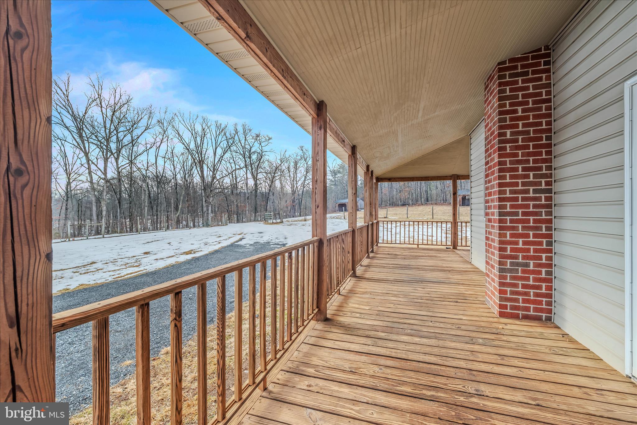 344 Tub Run Hollow Road Hedgesville, WV 25427 - Photo 35 of 85 a view of a balcony with wooden floor and fence