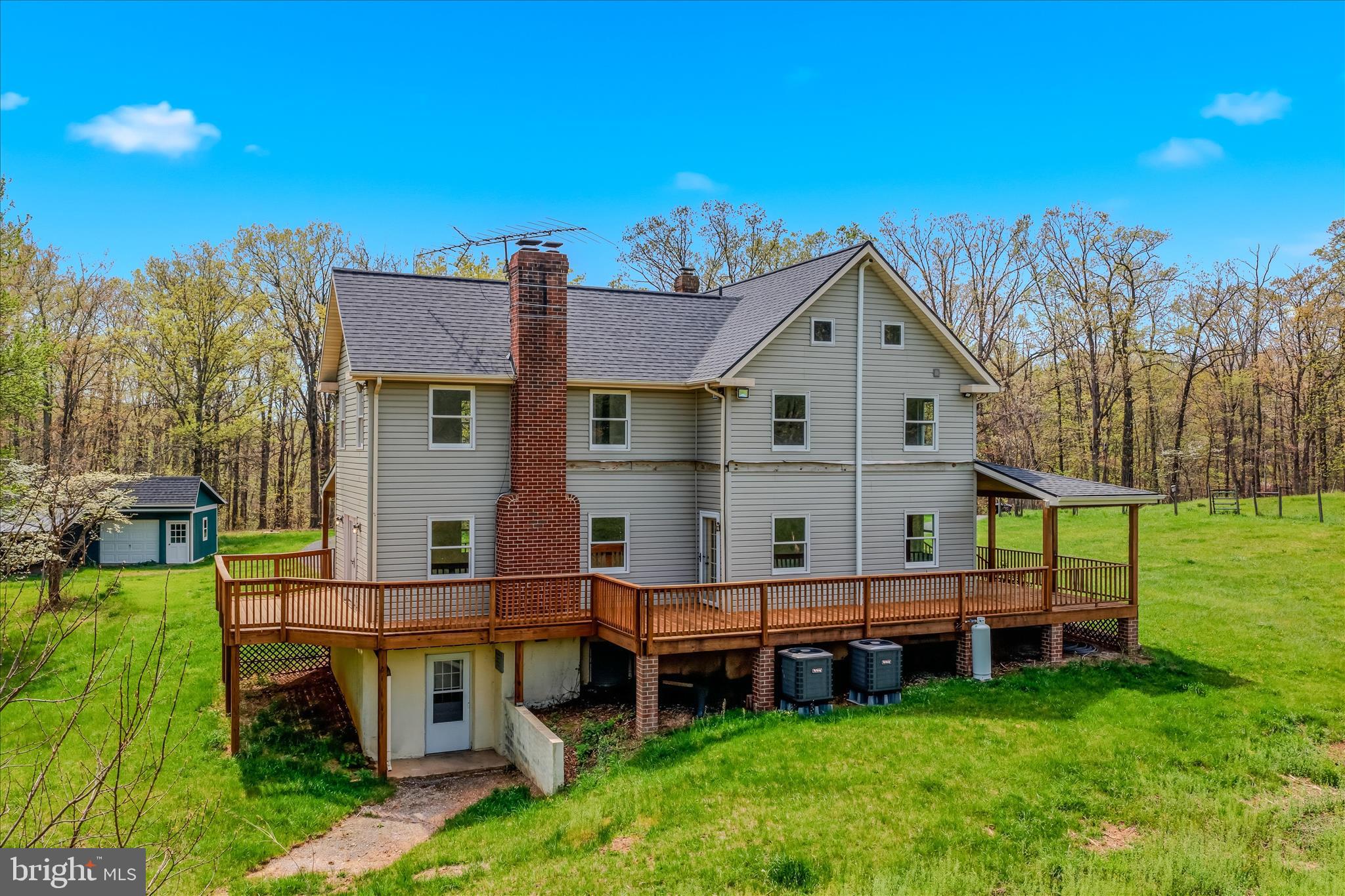 344 Tub Run Hollow Road Hedgesville, WV 25427 - Photo 4 of 85 a view of a house with a yard
