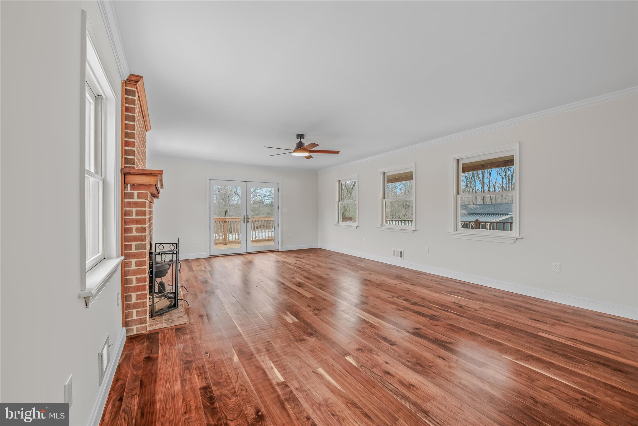 344 Tub Run Hollow Road Hedgesville, WV 25427 - Photo 41 of 85 a view of empty room with wooden floor and fan