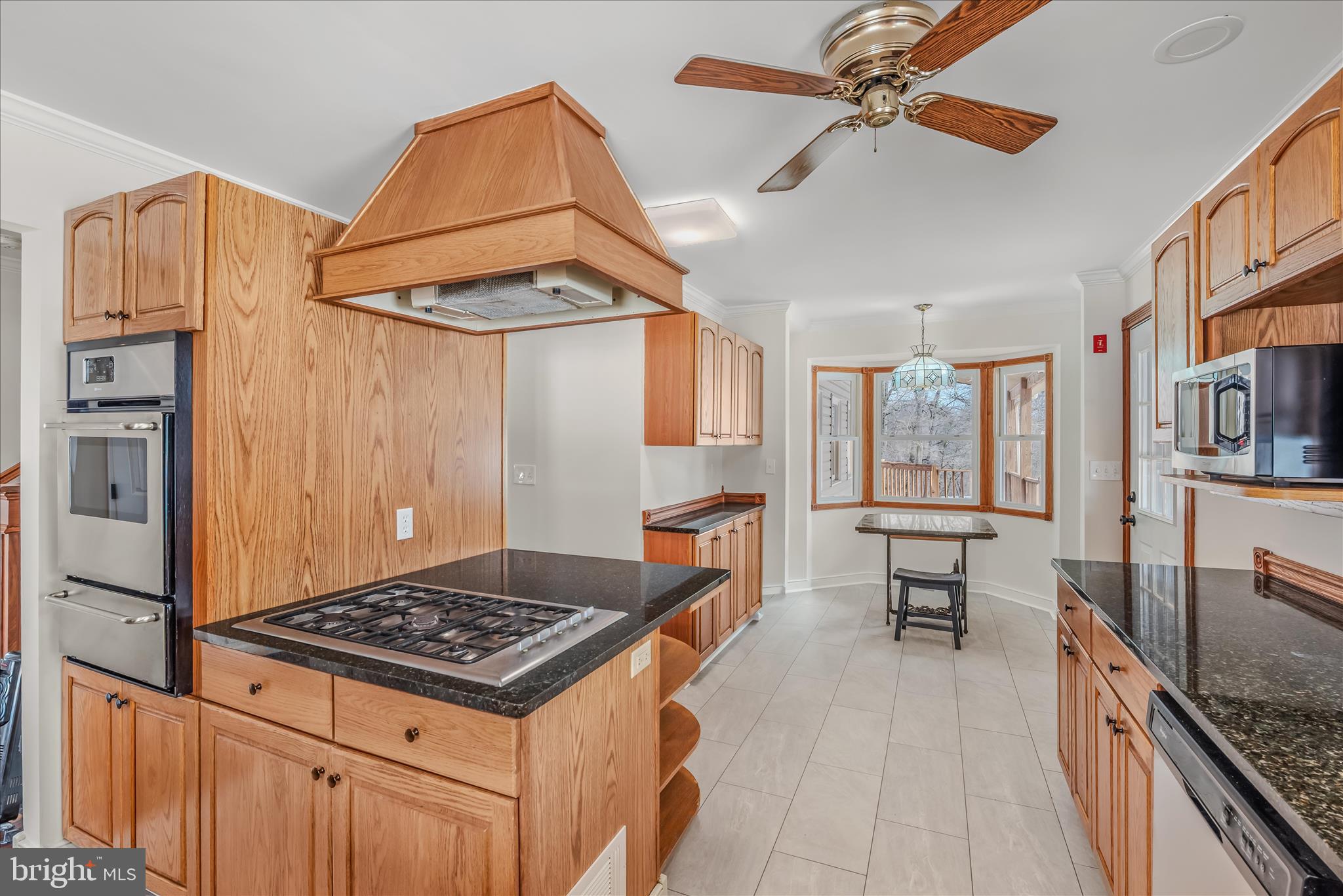 344 Tub Run Hollow Road Hedgesville, WV 25427 - Photo 45 of 85 a kitchen that has a stove and a table in it