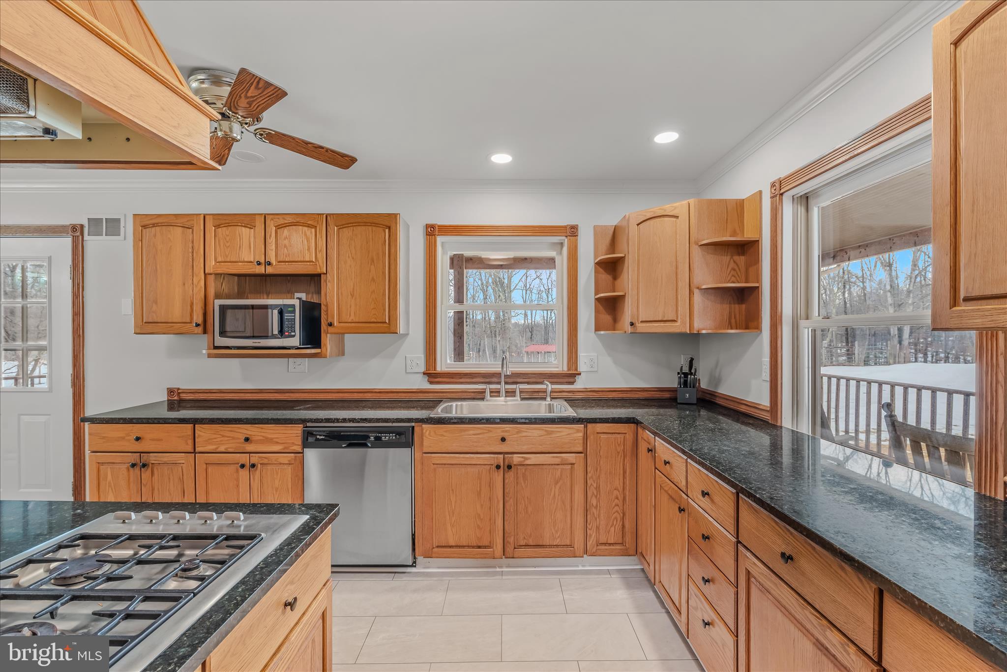344 Tub Run Hollow Road Hedgesville, WV 25427 - Photo 46 of 85 a kitchen with stainless steel appliances granite countertop a stove and a sink