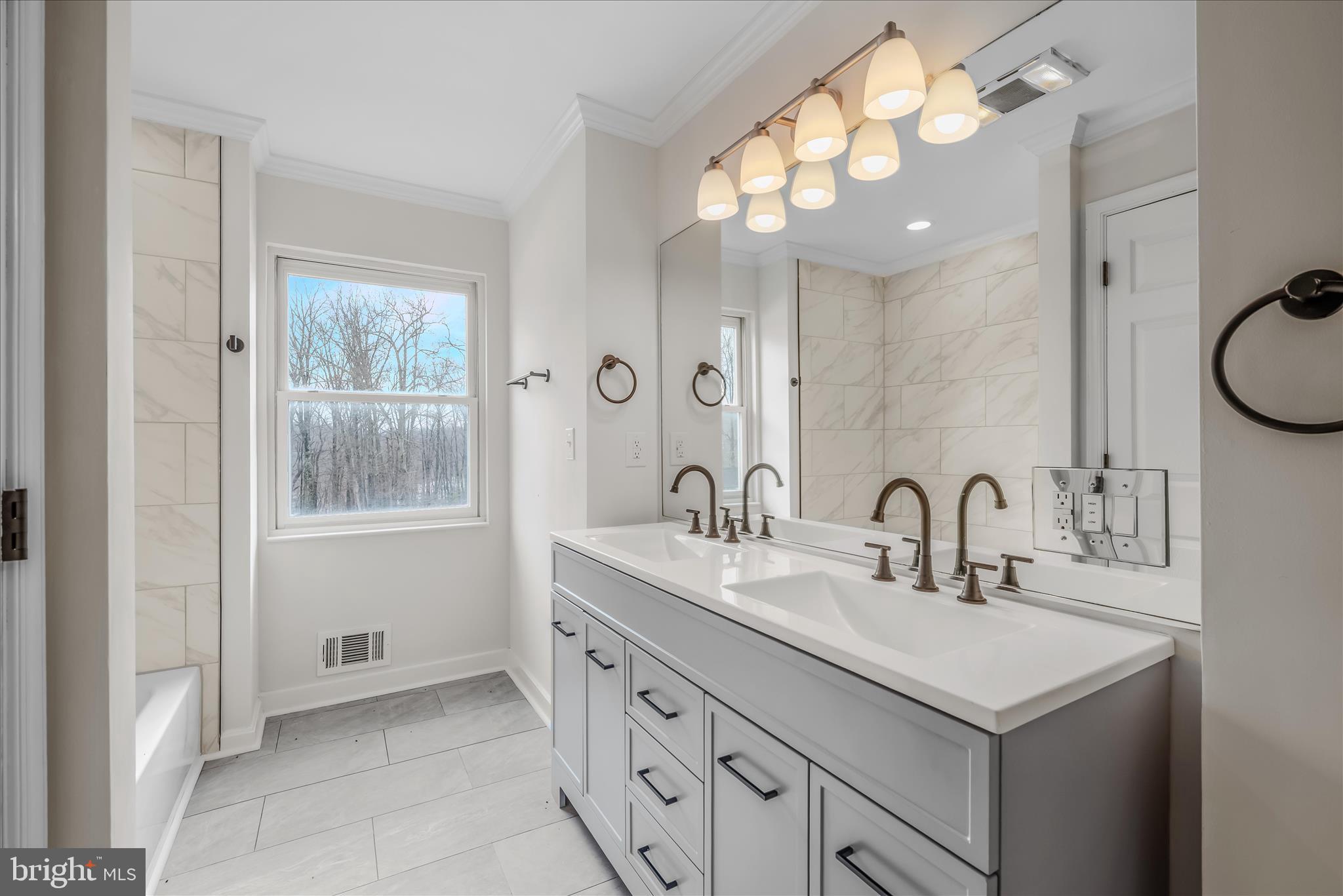 344 Tub Run Hollow Road Hedgesville, WV 25427 - Photo 53 of 85 a bathroom with a sink vanity and a mirror