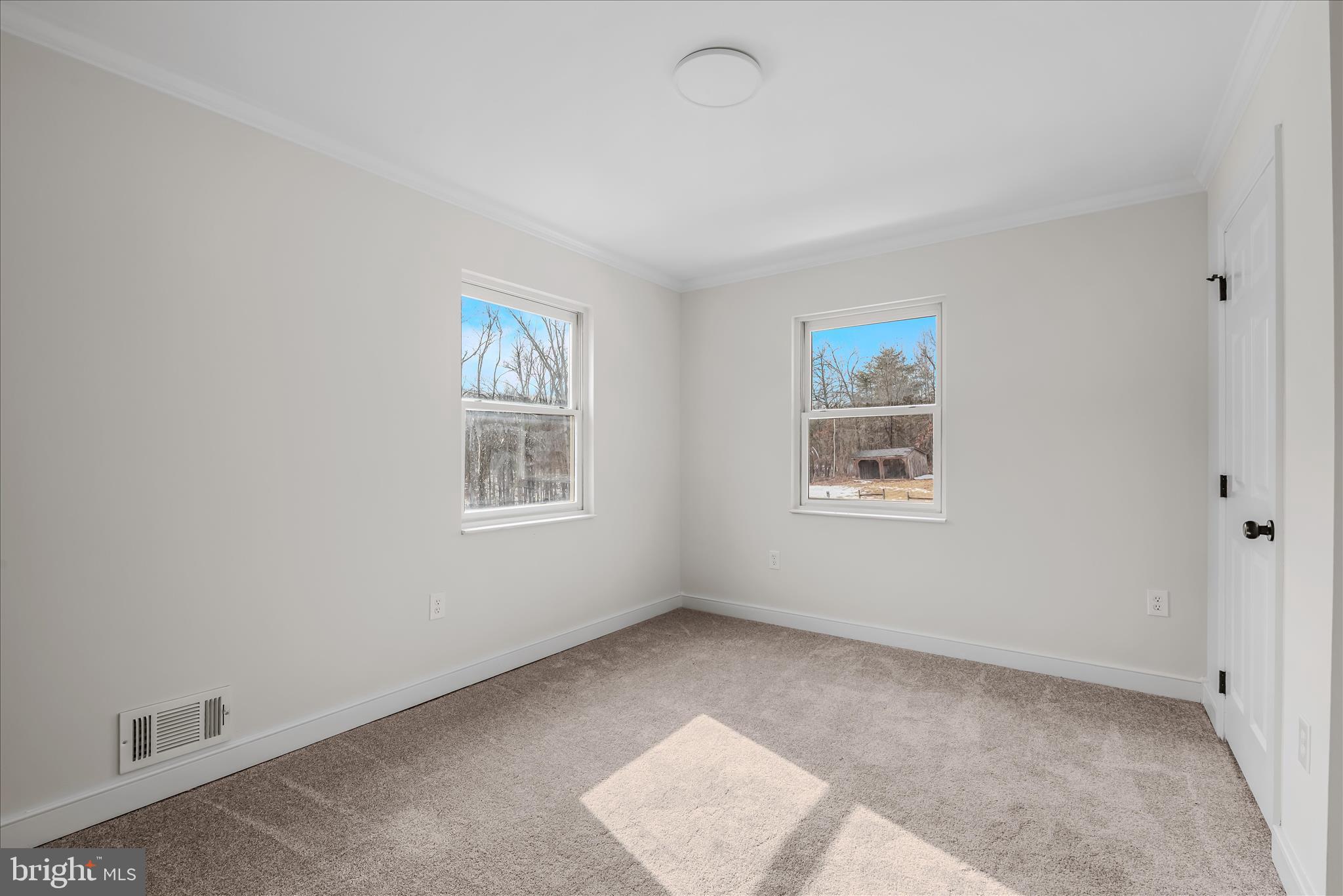 344 Tub Run Hollow Road Hedgesville, WV 25427 - Photo 56 of 85 a view of an empty room with a window