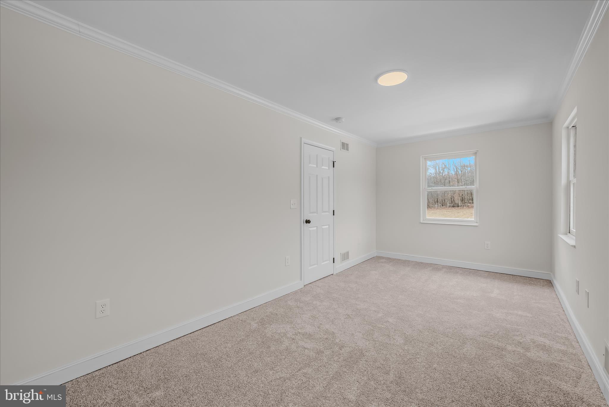 344 Tub Run Hollow Road Hedgesville, WV 25427 - Photo 62 of 85 a view of an empty room with a window