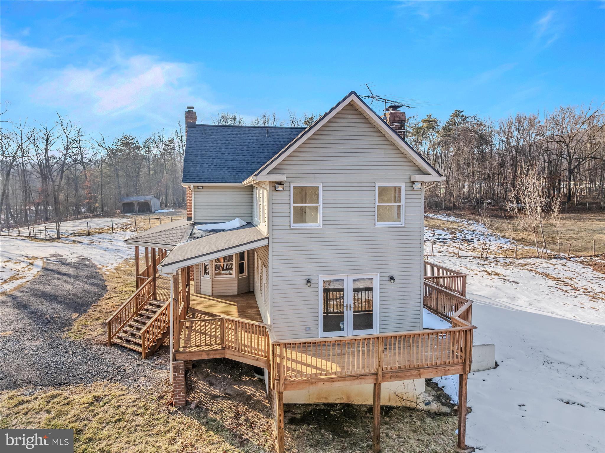 344 Tub Run Hollow Road Hedgesville, WV 25427 - Photo 68 of 85 a view of a house with a yard chairs and iron fence