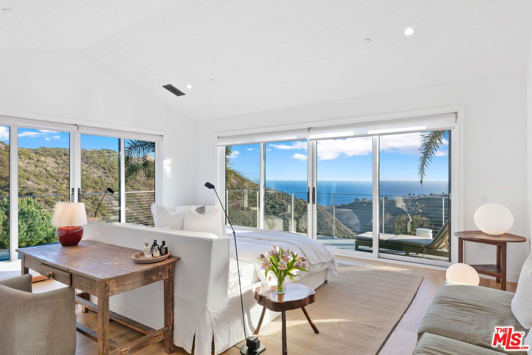 26575 Ocean View Drive Malibu, CA 90265 - Photo 15 of 40 a living room with furniture and a window