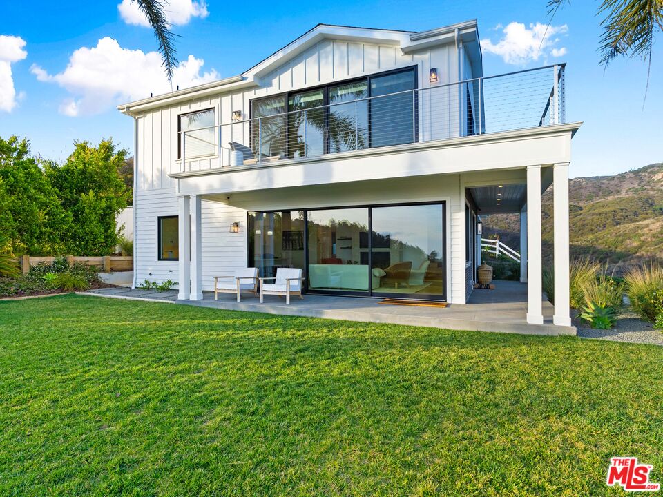 26575 Ocean View Drive Malibu, CA 90265 - Photo 2 of 40 a view of a house with a yard porch and sitting area