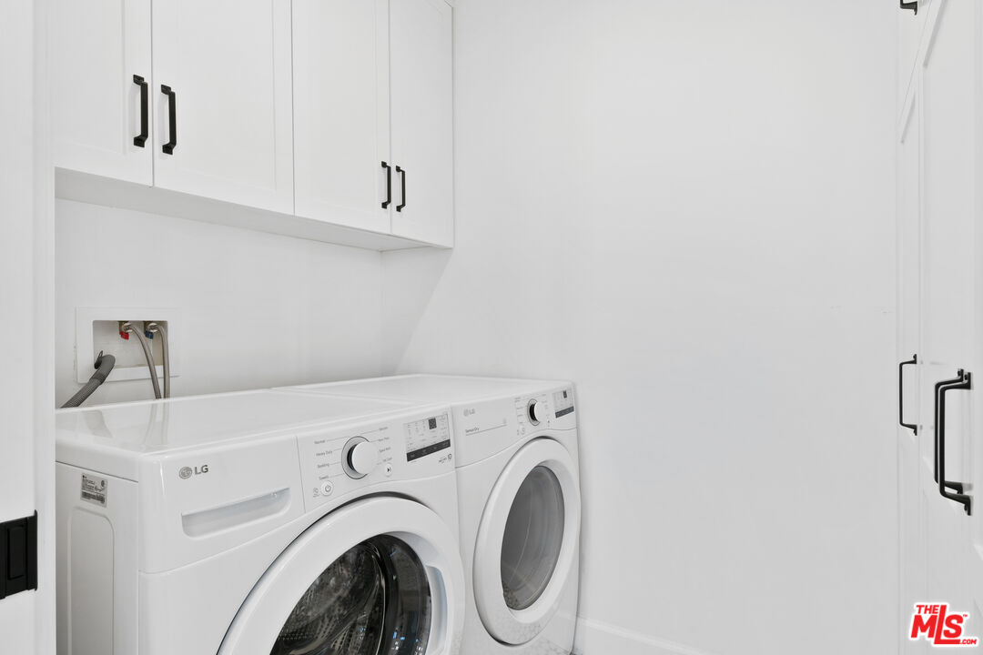 26575 Ocean View Drive Malibu, CA 90265 - Photo 30 of 40 a utility room with dryer and washer