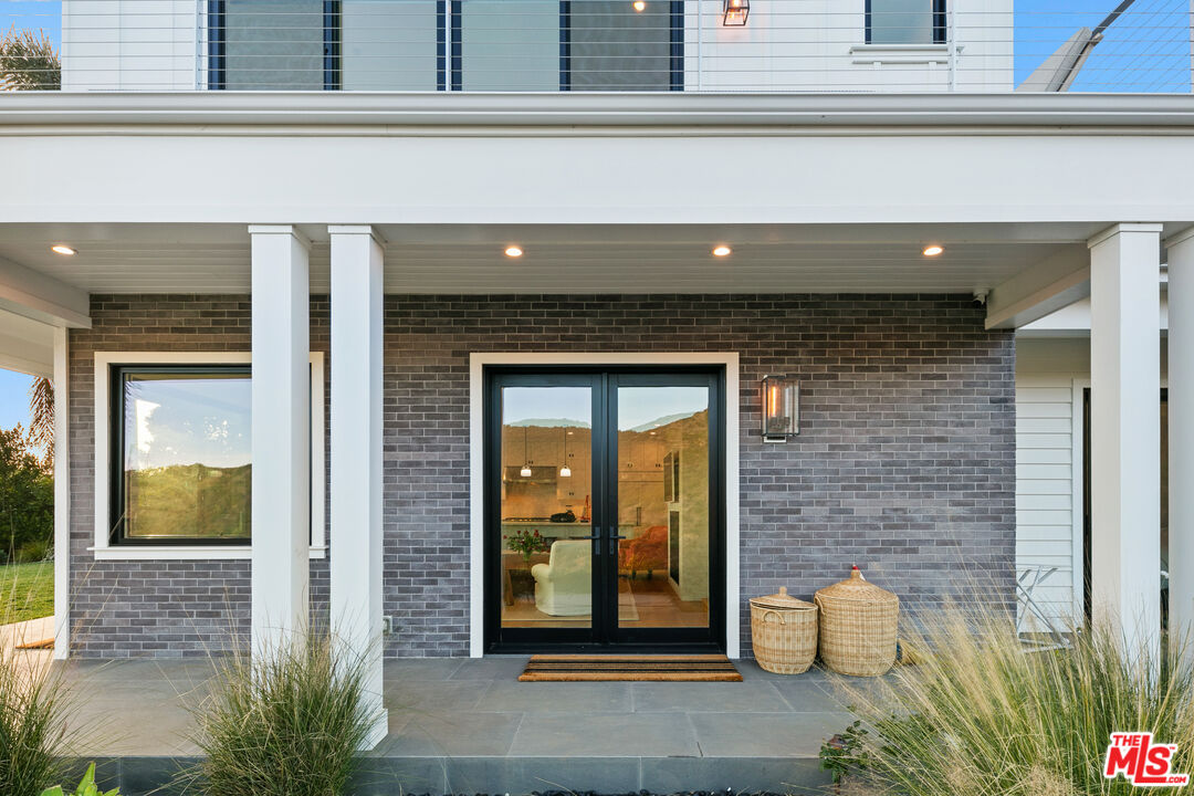26575 Ocean View Drive Malibu, CA 90265 - Photo 3 of 40 a view of entrance door of the house