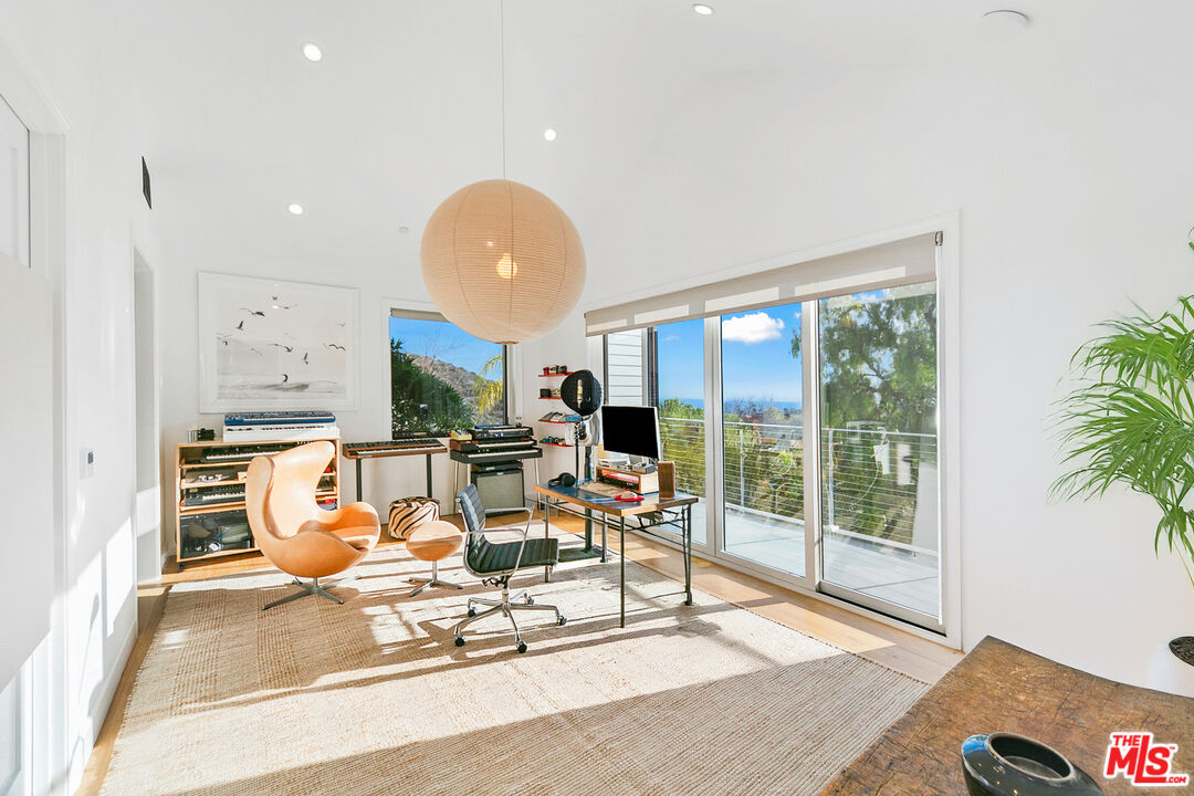 26575 Ocean View Drive Malibu, CA 90265 - Photo 32 of 40 a living room filled with furniture
