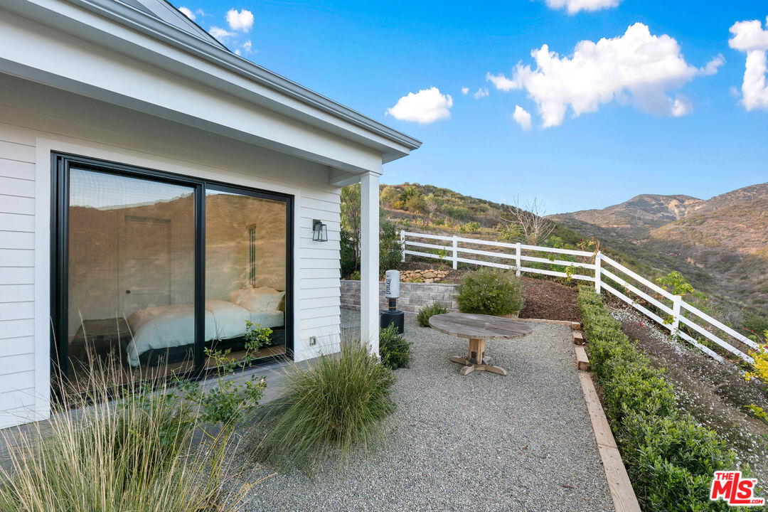 26575 Ocean View Drive Malibu, CA 90265 - Photo 36 of 40 a view of a chair and table in the balcony