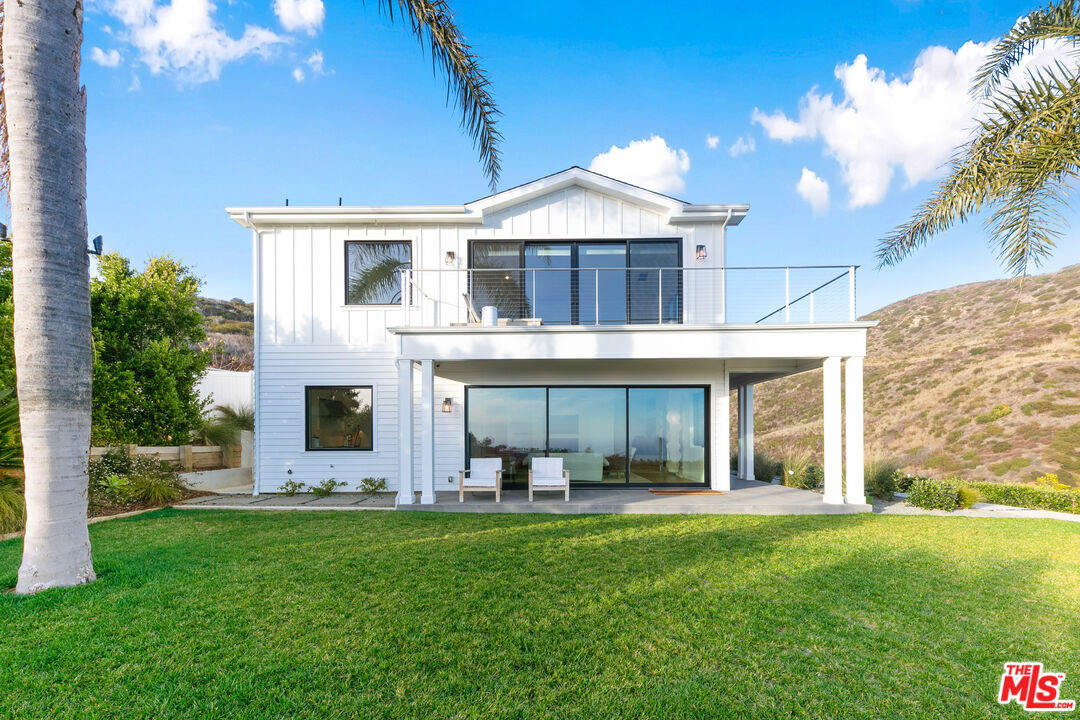 26575 Ocean View Drive Malibu, CA 90265 - Photo 38 of 40 a front view of a house with garden