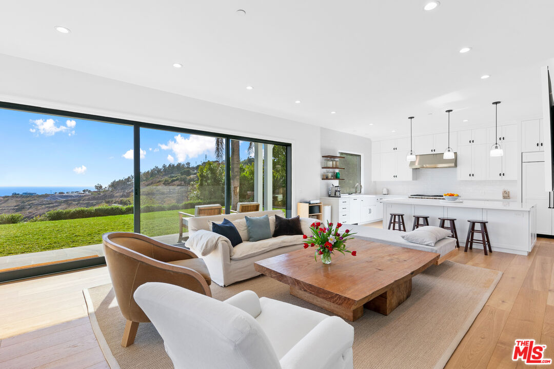 26575 Ocean View Drive Malibu, CA 90265 - Photo 4 of 40 a living room with furniture and a large window