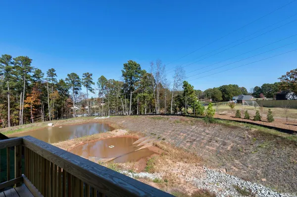 a view of a backyard with a swimming pool
