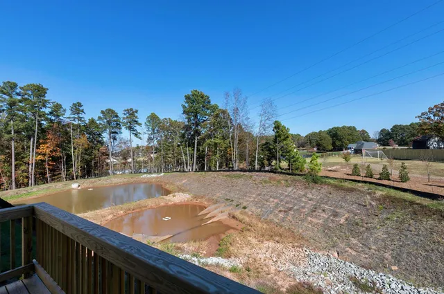 a view of a backyard with a swimming pool
