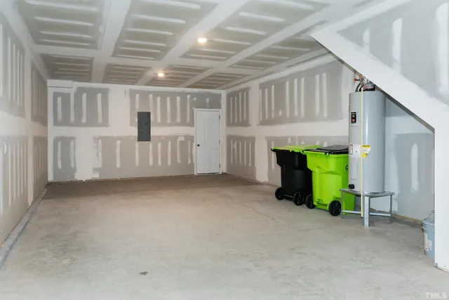 a view of an empty room with a kitchen