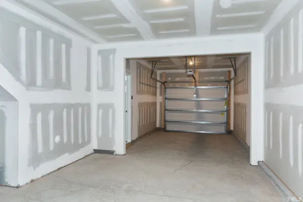 a view of an empty room with white walls