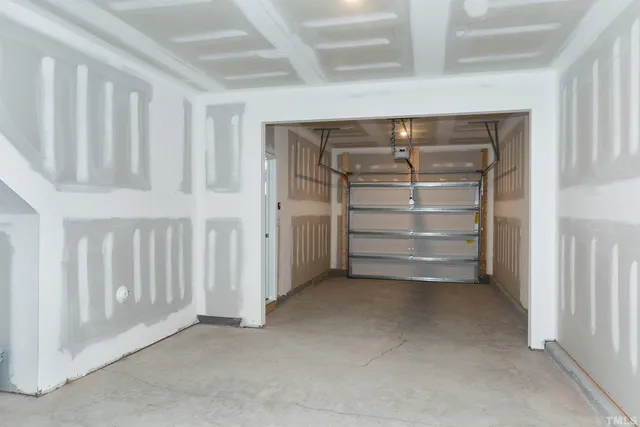 a view of an empty room with white walls