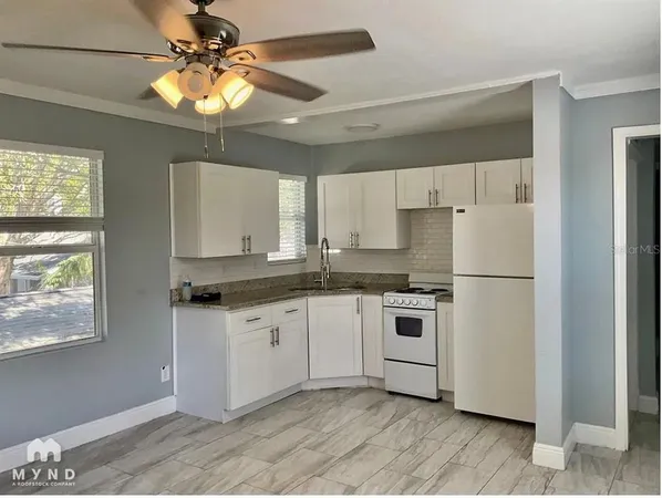 a view of a kitchen and a window
