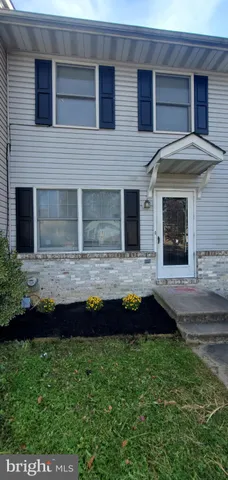 a view of house with yard