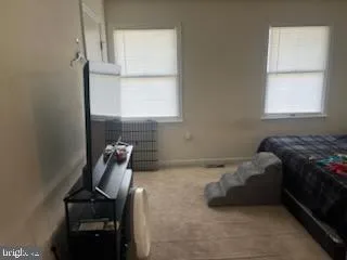 a room with a bed and a window