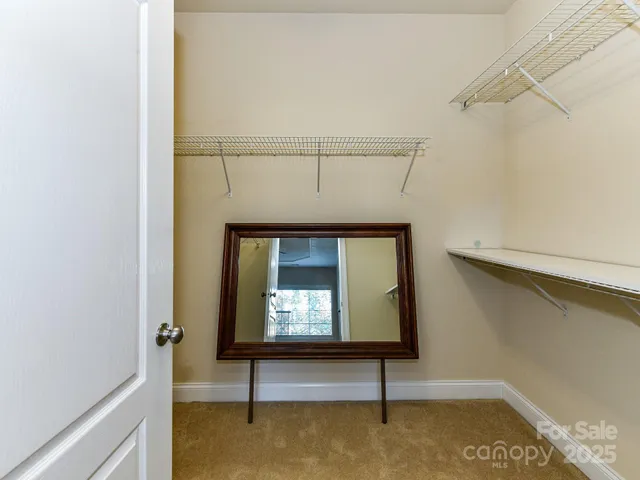 a living room with a bench and a rug