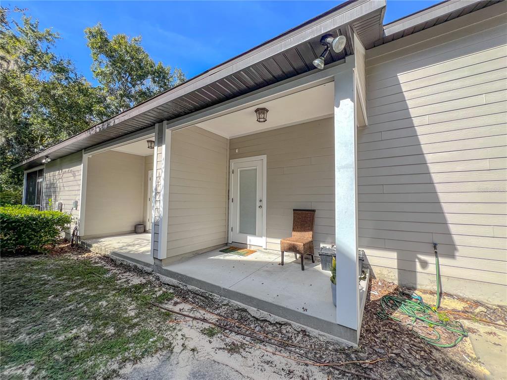 7348 Northwest 47th Way Gainesville, FL 32653 - Photo 13 of 13 a view of a house with backyard and sitting area