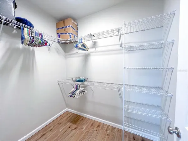 a view of storage and utility room with racks on the wall