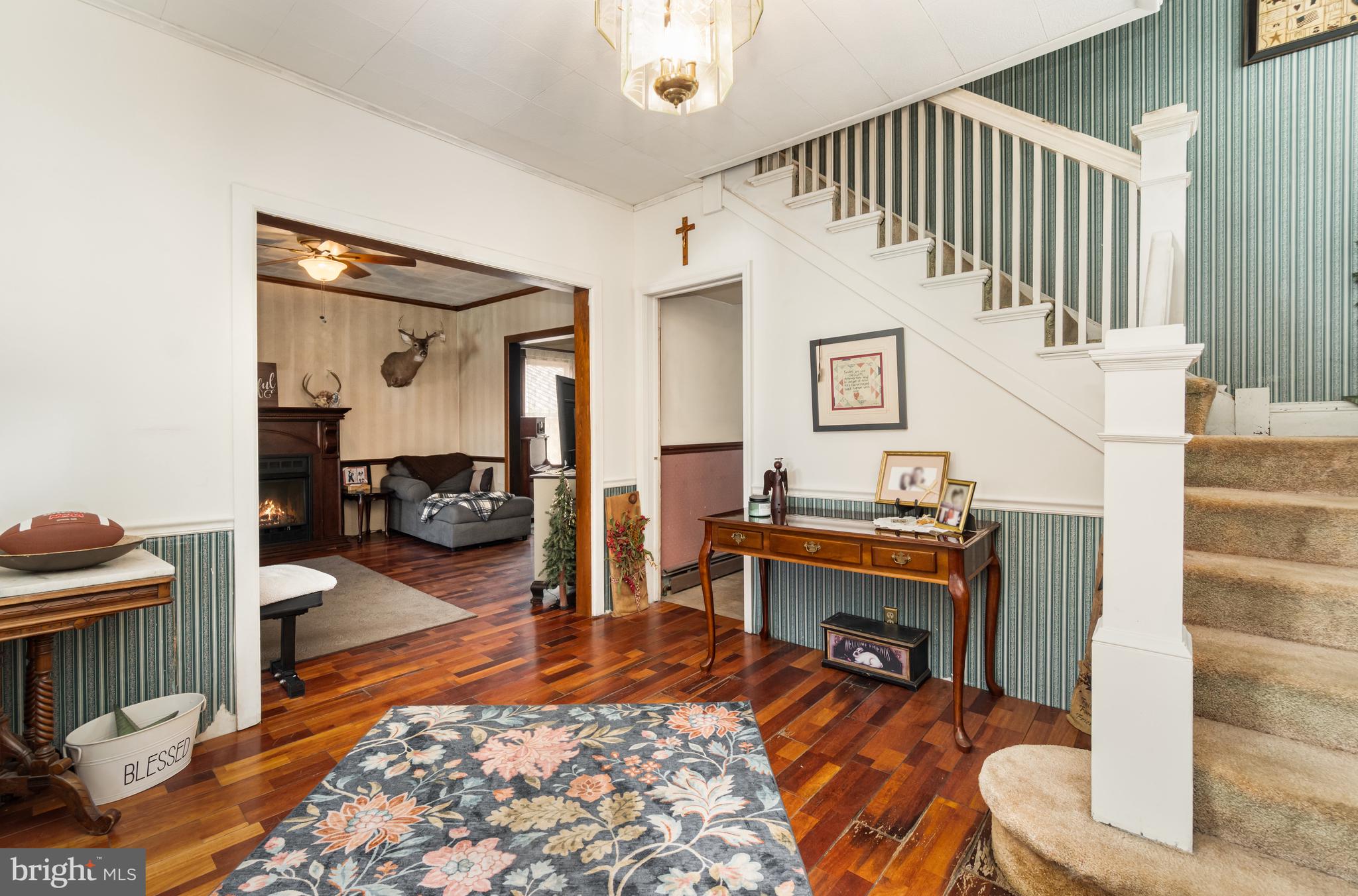 162 Swatara Road Shenandoah, PA 17976 - Photo 6 of 37 a living room with furniture and a fireplace