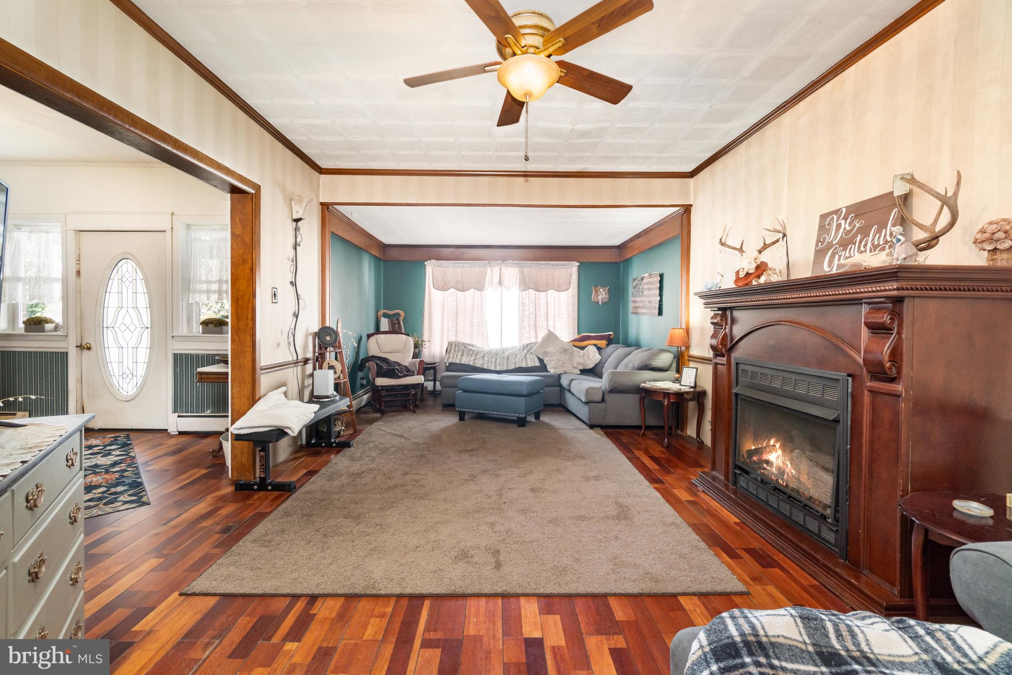 162 Swatara Road Shenandoah, PA 17976 - Photo 7 of 37 a living room with furniture and a fireplace