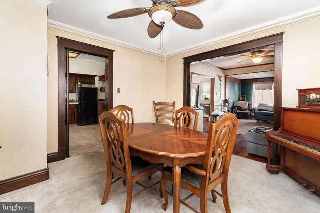 a bathroom with a sink a toilet and shower curtain