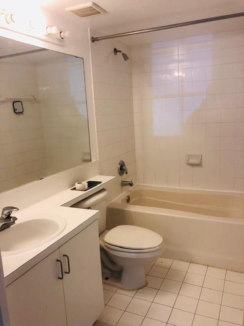 2011 Renaissance Boulevard, Unit 103 Miramar, FL 33025 - Photo 13 of 25 a bathroom with a sink a toilet and shower